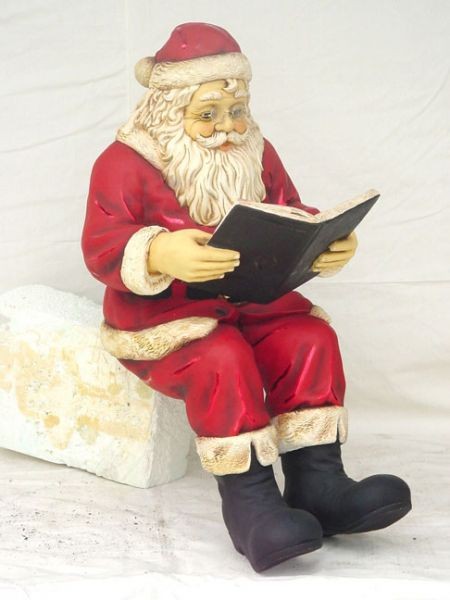 Weihnachtsmann Buch lesend