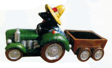 Maulwurfgärtner im Traktor mit Anhänger