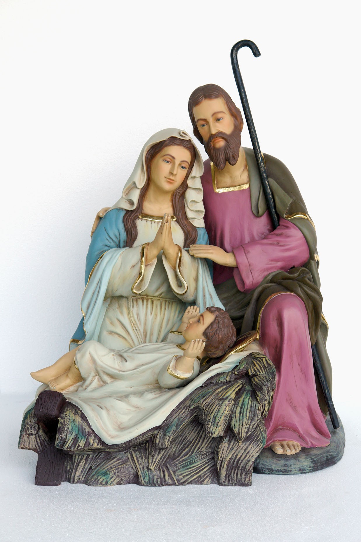 Heilige Familie hockend mit Josef, Maria und Jesuskind in Krippe