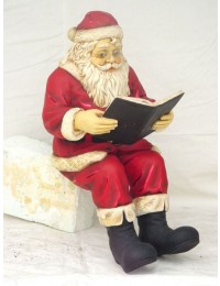 Weihnachtsmann Buch lesend