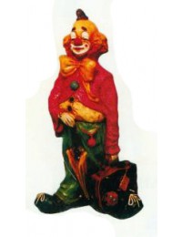 trauriger Clown klein mit offenem Koffer