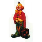 trauriger Clown klein mit offenem Koffer