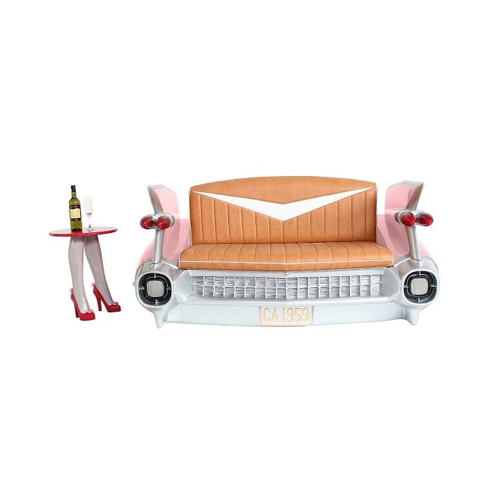 Sofa Cadillac Rosa mit braunem Polster und Zeitschriften und Get lebensgroß Sitzmöglichkeit, Tisch