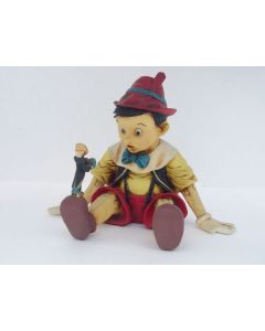 Pinocchio sitzend verkleinert