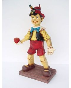 Pinocchio mit Apfel lebensgroß