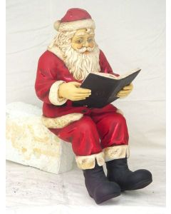 Weihnachtsmann Buch lesend lebensgroß